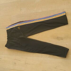 Kappa men's black track pants with blue yellow pink side stripes. Size L